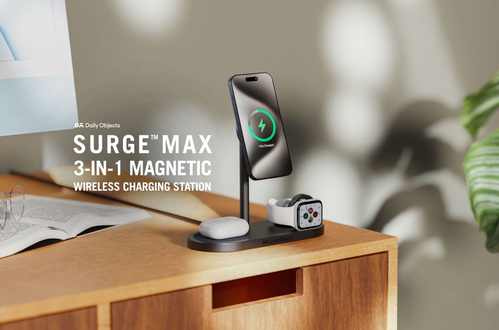 DailyObjects Surge™ Max 3-in-1 Magnetic Charging Station on a tabletop, simultaneously charging an iPhone, AirPods, and Apple Watch with a clean, modern setup and soft ambient lighting.