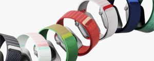 Colourful nylon Apple Watch bands arranged in a spiral, showcasing DailyObjects Track Nylon Watch Straps in multiple hues.