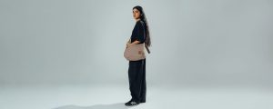Khaki March crossbody bag from DailyObjects worn across the body, ideal for everyday carry and gifting.