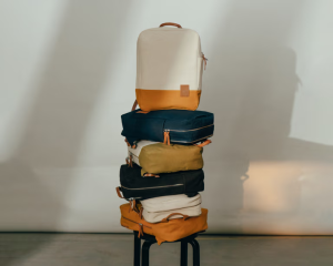 Stack of DailyObjects 9 to 9 Backpacks in multiple colours — versatile Secret Santa gifts for men who carry everything.