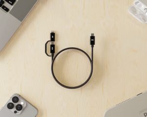 Black Kevlar core 2‑in‑1 100W USB-C to USB-C and Lightning charging cable on wooden desk