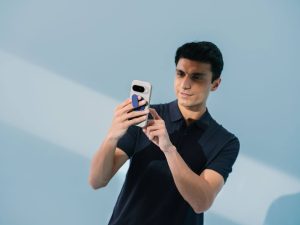 Lineup of Stack modular phone cases for Pixel 10 in black, coral, mint, blue, and silver with different accessories attached.