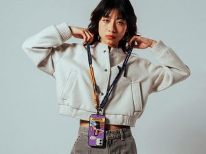 Crossbody phone lanyard worn as a functional everyday accessory