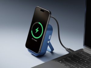 Blue Loop power bank placed on a desk, designed for charging everyday carry essentials during winter travel and workdays.