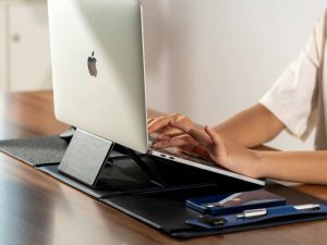 Side view of laptop stand showing ergonomic height and airflow support