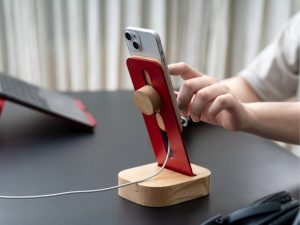 Using a phone stand for long video calls to maintain upright posture