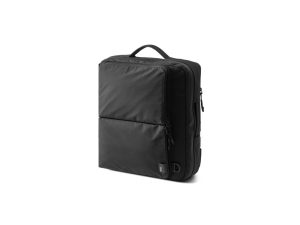 Convertible briefcase worn as a backpack, suitable for work and travel in a modern everyday carry setup.