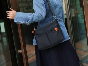 Retreat crossbody bag worn while exploring a beach destination