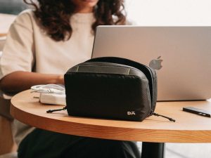 Vault tech organiser keeping gadgets and cables secure during a winter vacation