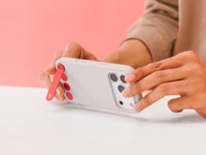 Neutral leather phone case styled with minimal workwear outfit