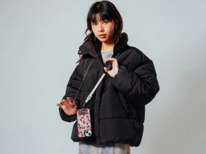 Stylish phone lanyard ideas with bold strap adding contrast to neutral outfit