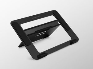 Travel laptop riser adjustable design used in compact bedroom workspace