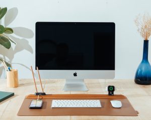 Organised workspace with desk accessories including charger, stand and organiser for productivity