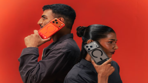 Two people holding Stack Clear cases side by side in Flamingo and Raven tints, showing both colour options
